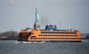 The ferry Andrew J. Barberi passing in front of the Statue of Liberty