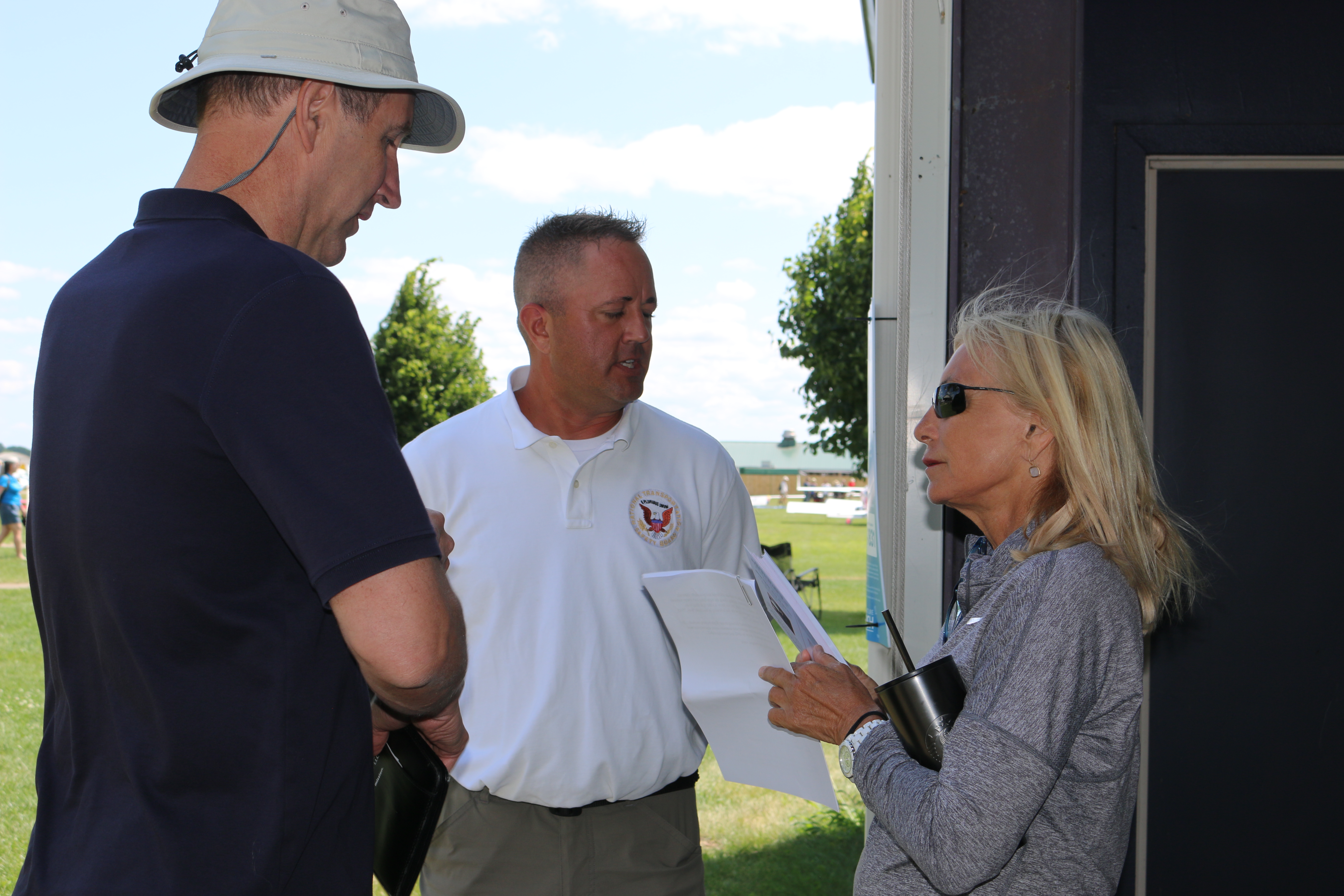 Mike Folkerts and Aaron Sauer talk with guest speaker and acrobatic pilot Patty Wagstaff